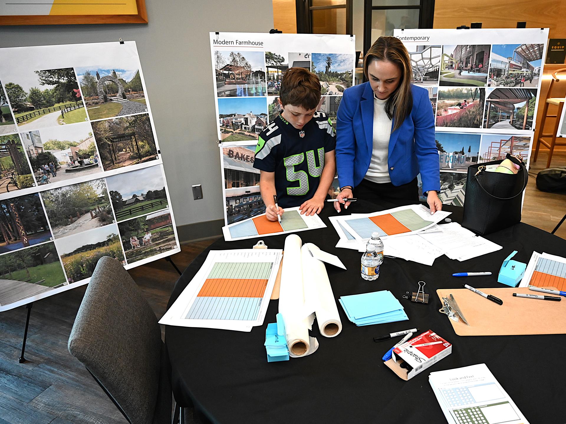 Deerfield Samia and son looking at plans