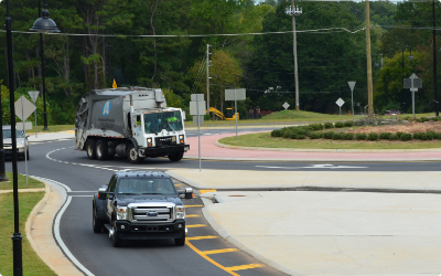 Garbage truck drives through round-about