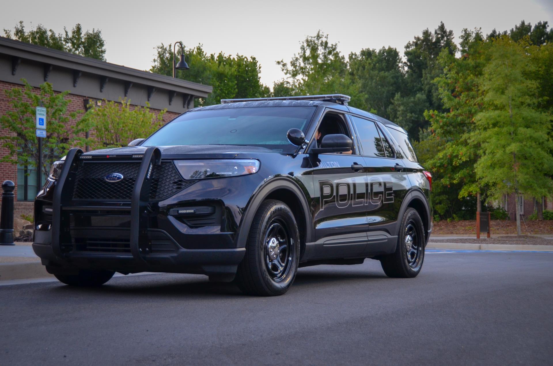 Large, black Milton Police Department SUV