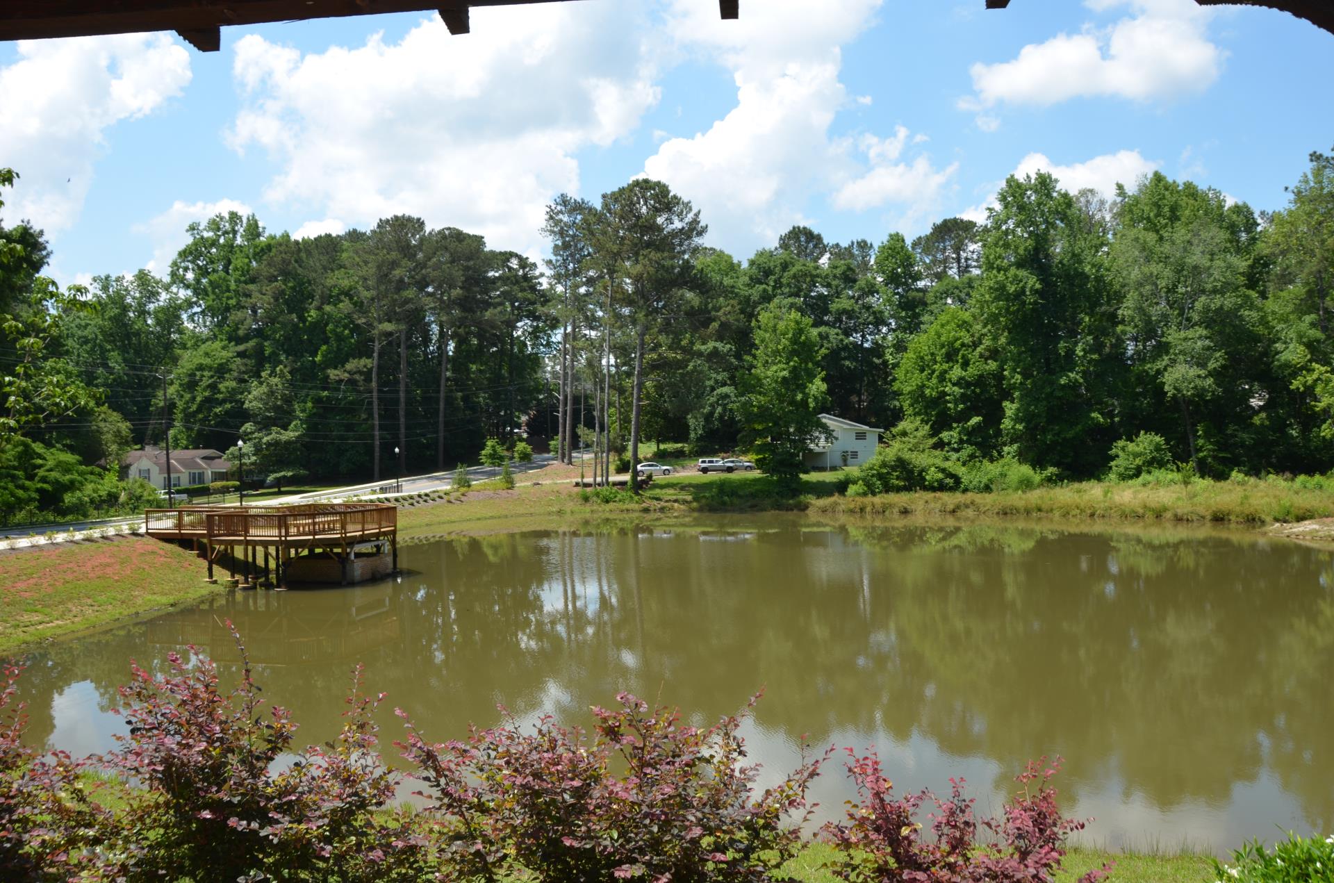 Mayfield pond pier and colorful bushes