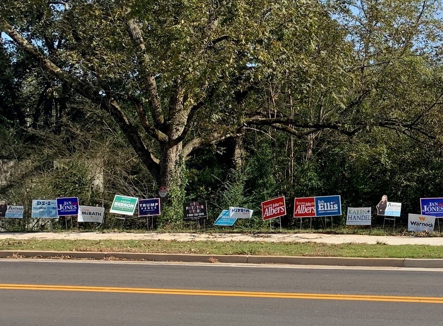 RESHAPED.election.signs.outside.Milton.Library